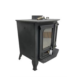 Cast iron stove, pointed arch front and enclosed by two doors, 