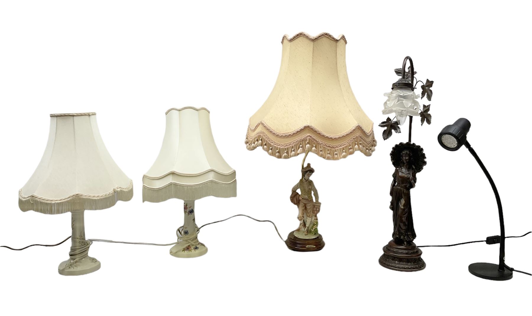 A Belcari figural table lamp, modelled as a young gent leaning upon brick wall, on turned wood base, signed, H70cm incl shade, together with bronzed figural table lamp of a lady with parasol upon ornate circular plinth base, two ceramic table lamps and another lamp (5)