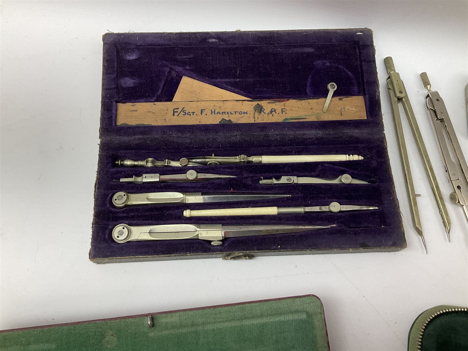 Negretti & Zambra drawing instrument set, the ruler with manuscript name 'F/Sgt. F. Hamilton R.A.F. 194(?)', cased; four other drawing instrument sets by Anker-Precision Germany, EcoBra, Temple etc, all cased; and quantity of loose drawing instruments