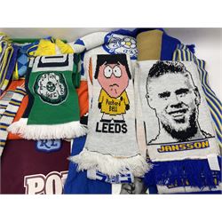Collection of Leeds United scarves, hats and t-shirts, together with a Washington Redskins NFL sweatshirt and an Australian rugby league shirt
