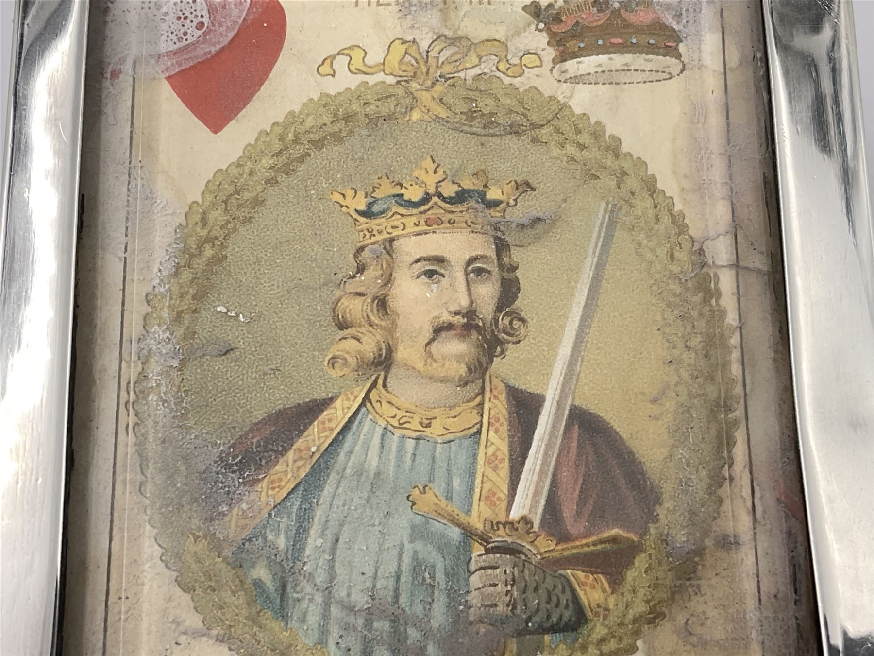 Edwardian silver mounted playing card case, hallmarked William Harrison Walter, Birmingham 1903, the sides each with a period playing card set behind a bevelled glass panel, the hinged cover with later engraving 'Presented to Norman T Crombie Esq by the officers & men of the 31st WR Detachment for services rendered 1917-1918', with red leather lined interior, the three compartments upon a sprung base and containing two later wooden Whist markers, case H12.5cm