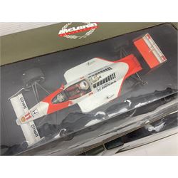 Three Paul's Model Art 1:18 scale die-cast McLaren racing cars - Mercedes MP4/11 D. Coulthard; MP4/4 A. Prost; and Mercedes MP4/10 M. Hakkinen; all boxed (3)