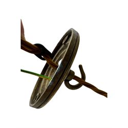 Set of two small and two large pendant lights, each with clear glass spherical shade with moulded swirl pattern, suspended from twisted cords, brass ceiling rose