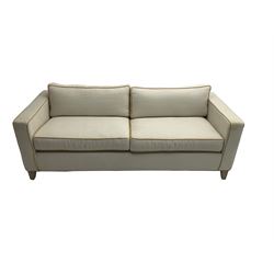Neptune - pair three seat 'Shoreditch' sofas,  upholstered in cream fabric with yellow stringing