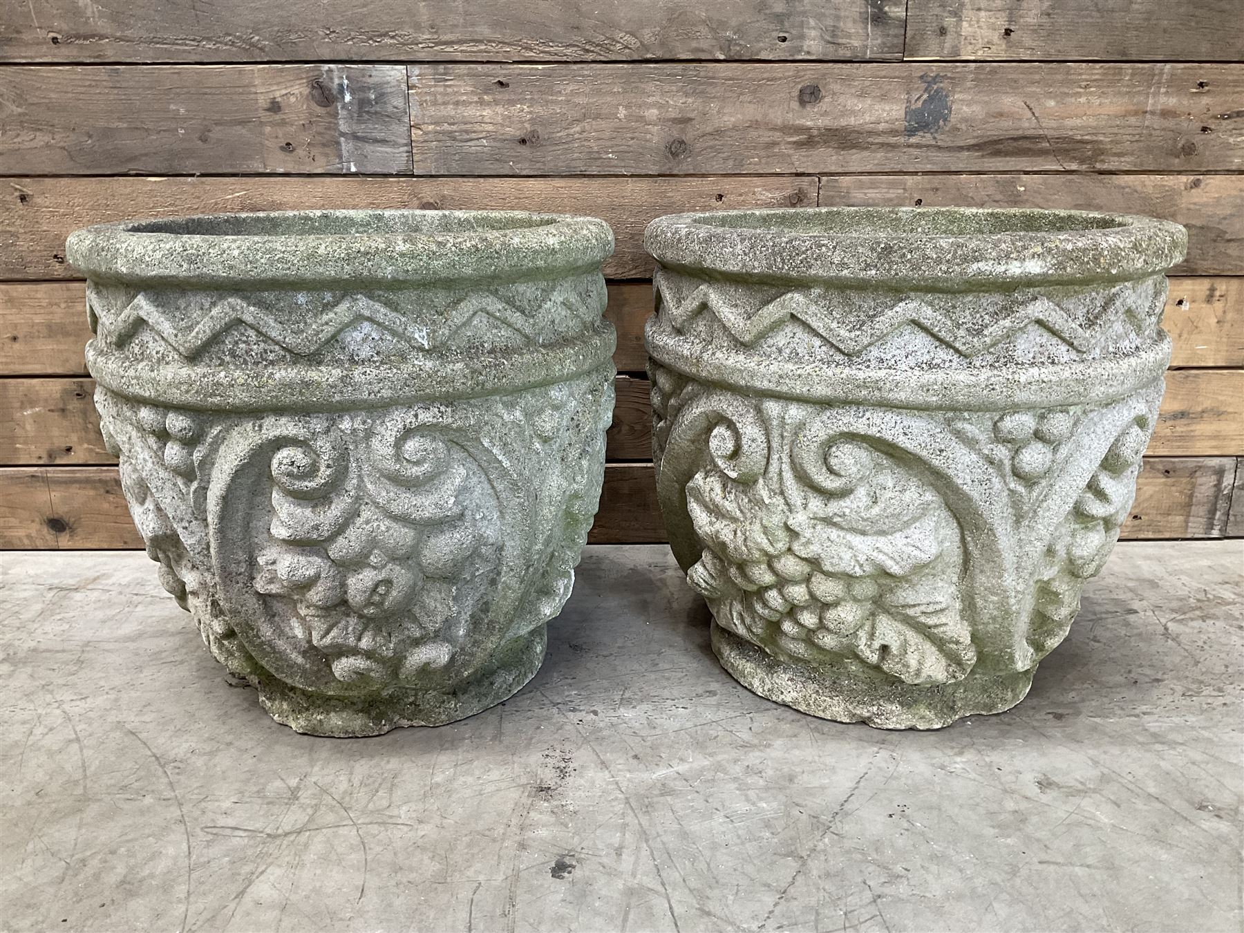 Pair of cast stone ornate circular planters