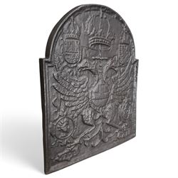 Early 20th century cast iron fireback, after an 18th century Flemish original, the arched plate cast in relief with the crowned Habsburg double-headed Imperial eagle and armorial shields of Charles V, Holy Roman Emperor