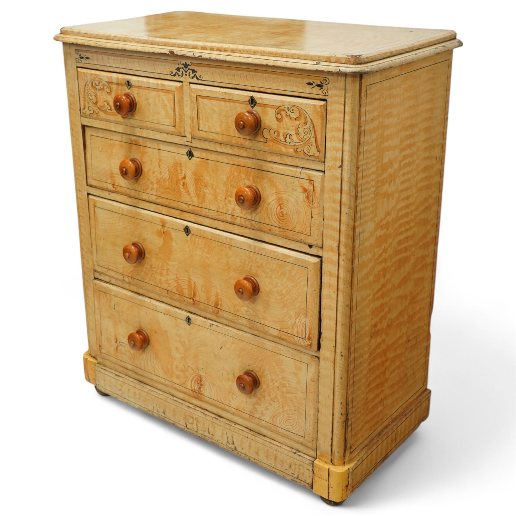 19th century pine painted chest of drawers, rectangular moulded top above two short and three graduated long drawers, each with painted foliate scroll and line detailing, turned knobs, and concealed turned feet, the sides with rounded corners and ebonised detail