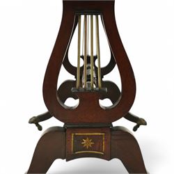 Regency mahogany and ebony inlaid fold-over tea table with reeded edge above spiral reeded centre stretcher on lyre supports with brass star inlaid panel on out swept legs with lion paw brass castors 