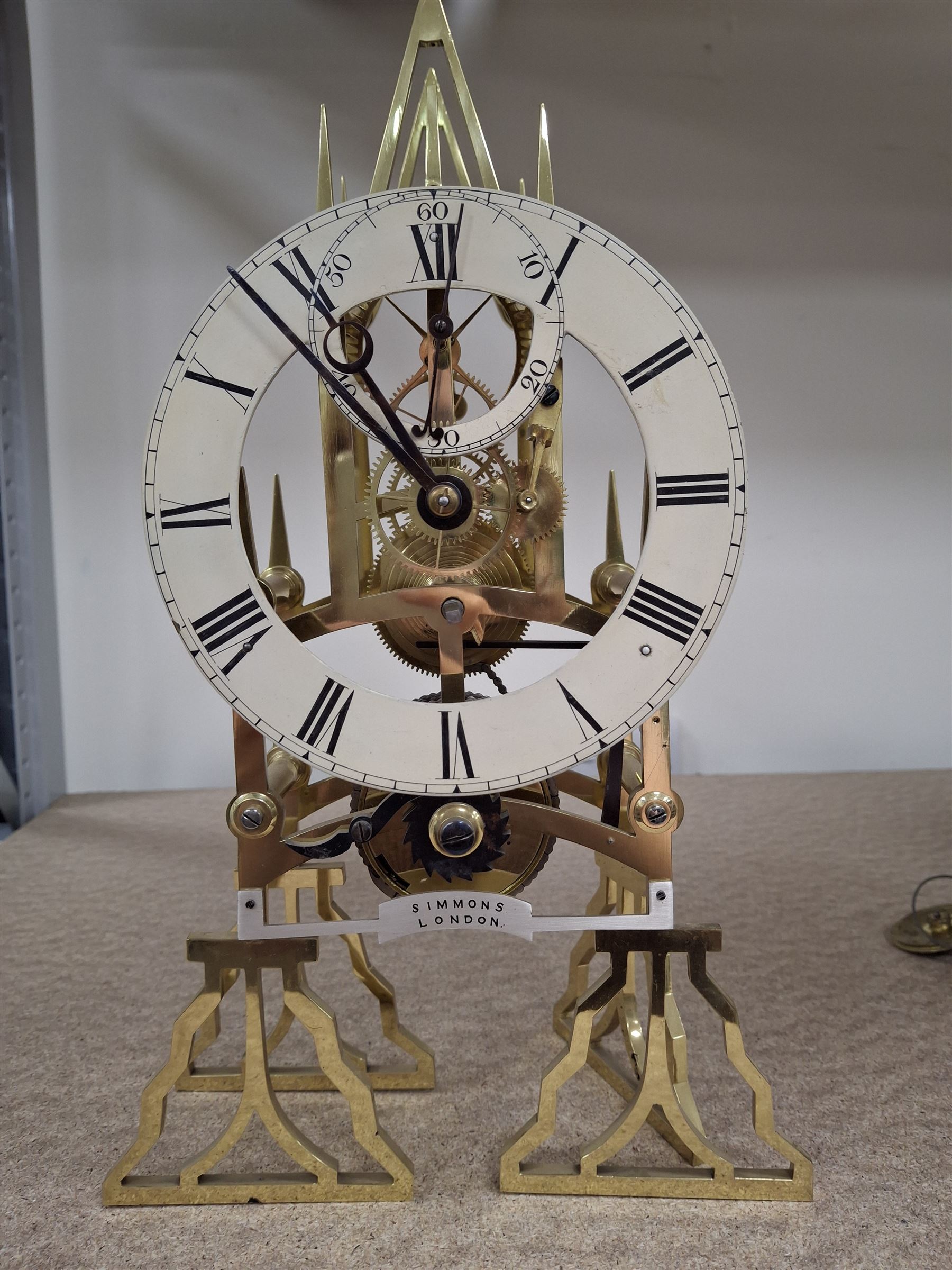 Two skeleton clock movements, tavern clock movement, and further clock movements, all for restoration 