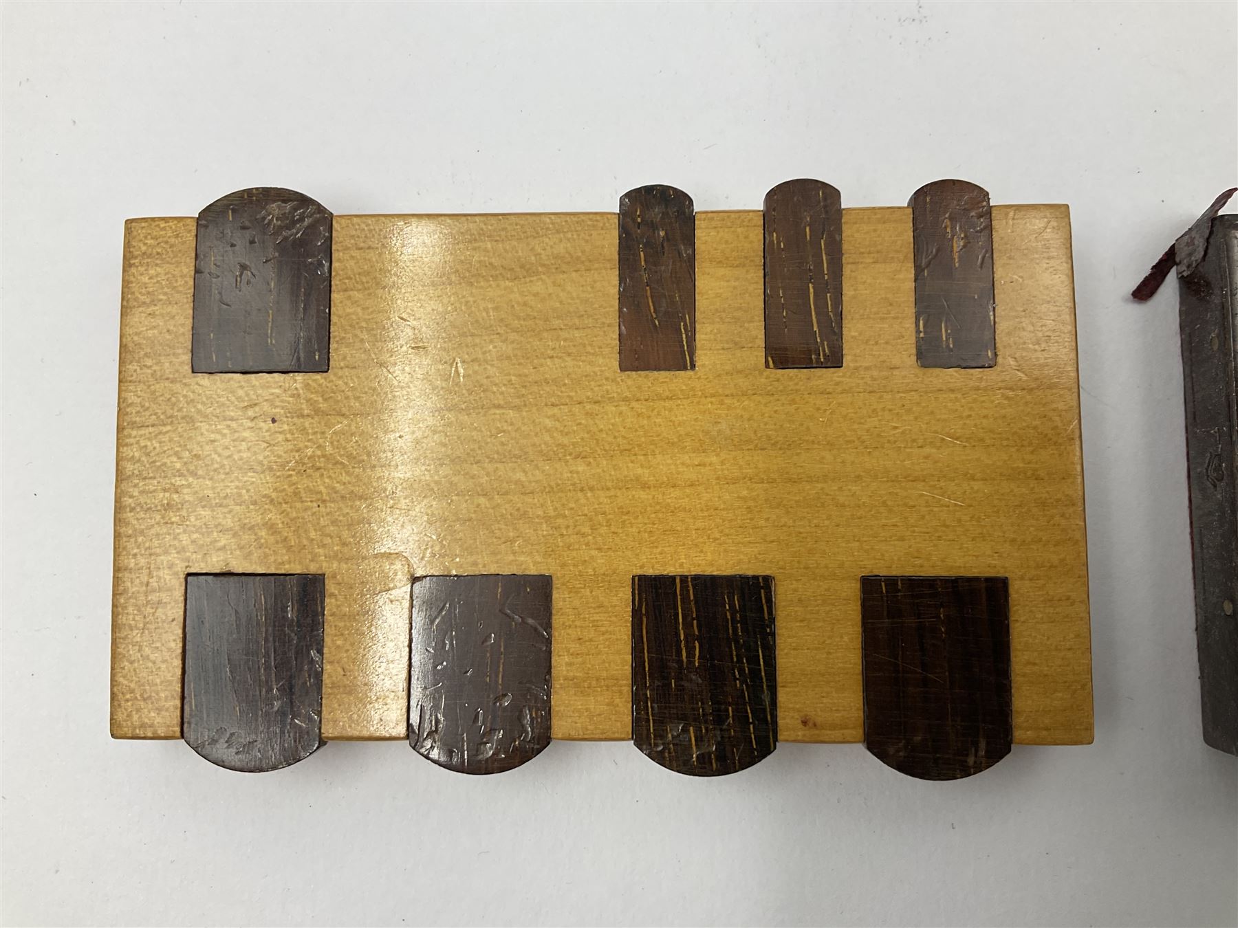 Edwardian silver mounted playing card case, hallmarked William Harrison Walter, Birmingham 1903, the sides each with a period playing card set behind a bevelled glass panel, the hinged cover with later engraving 'Presented to Norman T Crombie Esq by the officers & men of the 31st WR Detachment for services rendered 1917-1918', with red leather lined interior, the three compartments upon a sprung base and containing two later wooden Whist markers, case H12.5cm