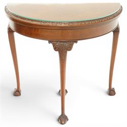 Leemings of Halifax - Georgian design mahogany demi-lune card table, the lunette fold-over top with carved edge and bevelled interior, raised on cabriole supports with acanthus carved knees, with draw-action rear support, terminating to ball-and-claw feet, makers plaque to rear
