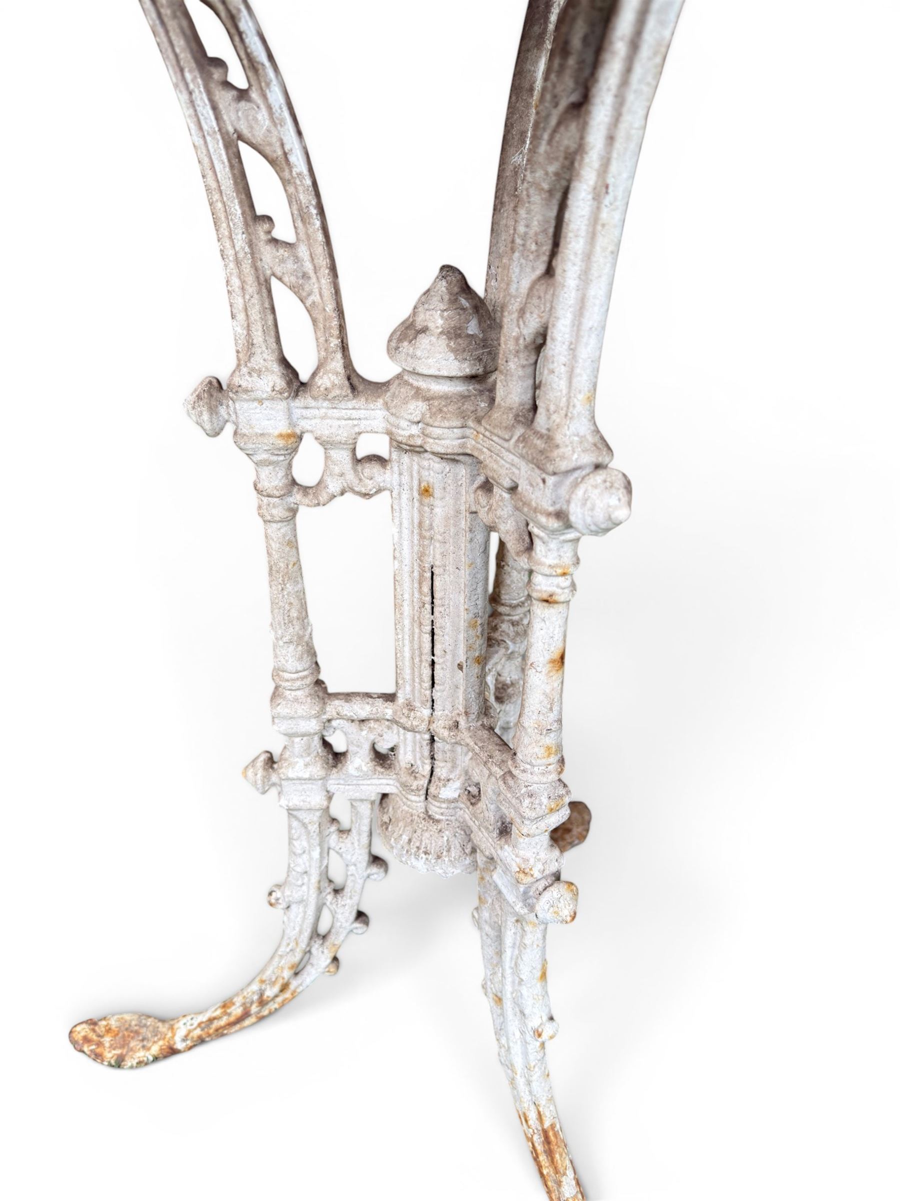 Victorian ornate cast iron garden table, trefoil base with central enclosed column, circular top with later marble, with registration mark