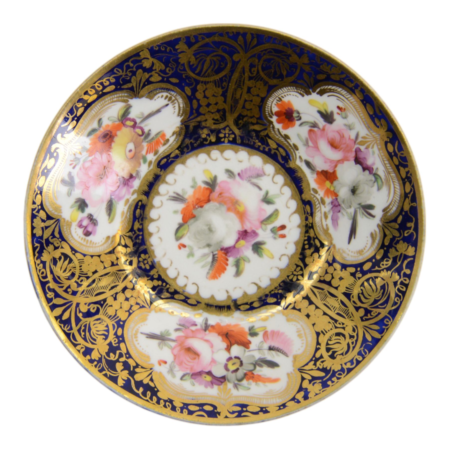 Coalport teawares, circa 1820-1840, comprising set of four trios, coffee cups, teacups and saucers, and slop bowl, decorated in the 830 pattern, with floral sprays and gilt shaped reserves, two further coffee cups and saucers, decorated with floral sprays upon blue grounds/with blue borders, and a similar coffee cup