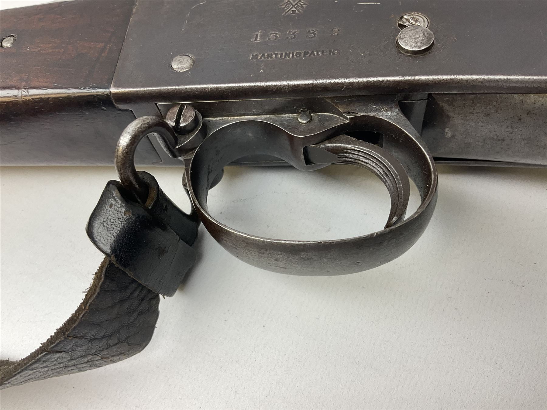 Braendlin Armoury Martini action .577/450 falling back rifle, the 85cm rifled barrel stamped Alex. Henry Edinburgh & London with two barrel bands including Yatagan bayonet side fitting and clearing rod under, with leather sling, serial no.13332, L126cm (NB. Firing pin broken). 
