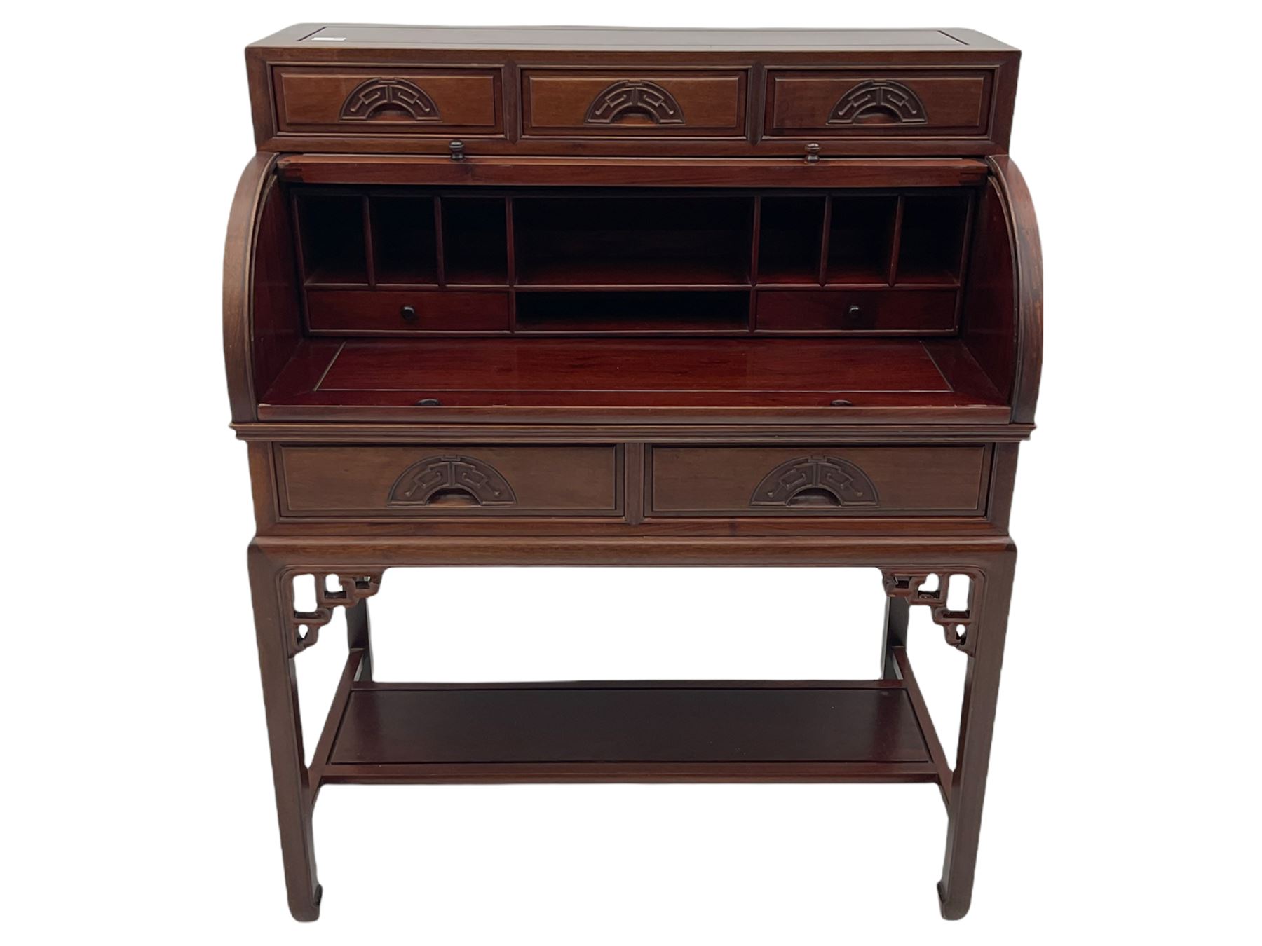 Hardwood cylinder desk, three drawers raised over curved lid, fitted interior with slide, the supports joined by undertier with fret work brackets 