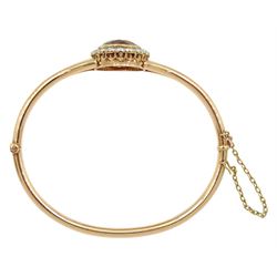 Early 20th century 15ct rose gold oval citrine and milgrain set old cut diamond hinged bangle, total diamond weight approx 1.10 carat