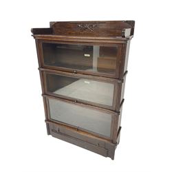 Globe Wernicke - early 20th century oak library bookcase, three tiers enclosed by hinged and sliding glazed doors, drawer to base