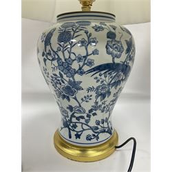 Pair of large table lamps of baluster form, decorated with exotic birds perched in flowering trees, upon gilt circular bases, including shade H68cm