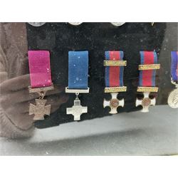 Limited edition large framed display board with sixty half-size copies of British Gallantry and Campaign Medals produced by Danbury Mint; all with ribbons and associated booklet