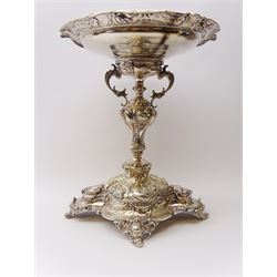 Large and impressive late 19th century Danish silver table centrepiece, the circular bowl with shaped rim embossed with shell, flower head and foliate scroll border, upon a baluster stem with twin scroll handles to shoulders, and domed quatrefoil base upon four foliate scroll feet, embossed throughout with conforming shell motifs and foliate scroll work, bowl and base impressed with maker's mark for V. Christesen, Copenhagen (1893-1910), alongside Danish Three Towers mark for 1889, with the Assay Master mark for Simon Groth (1863-1904), H47cm bowl W37cm, weight 88.83 ozt (2763 grams)