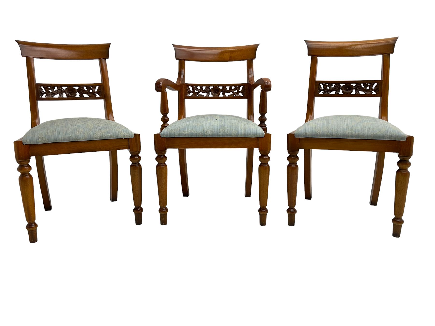 Georgian design yew wood twin pedestal dining table, circular top over four turned columns joined by base, raised on splayed and fluted cabriole supports with paw feet and castors (140cm x 108cm x 77cm); with set six (4+2) Georgian style yew wood dining chairs, middle rail pierced and carved with flowerhead and extending foliage, upholstered drop in seat, raised on turned tapering supports (50cm x 47cm x 86cm)