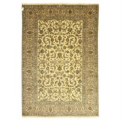 Central Persian Kashan carpet, ivory ground, field with an all-over design of scrolling pa...