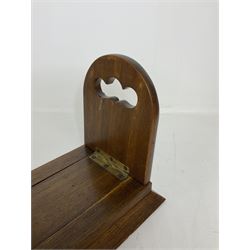 Victorian Betjemann oak book slide, of typical form, the curved hinged and sliding supports with mounted brass Gothic strapwork, stamped Betjemann's Patent 18026, H16.5cm W34cm D15cm