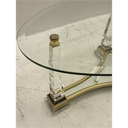 Classical style glass and brass oval coffee table, quatrefoil polished brass mirror base topped by glass obelisk legs