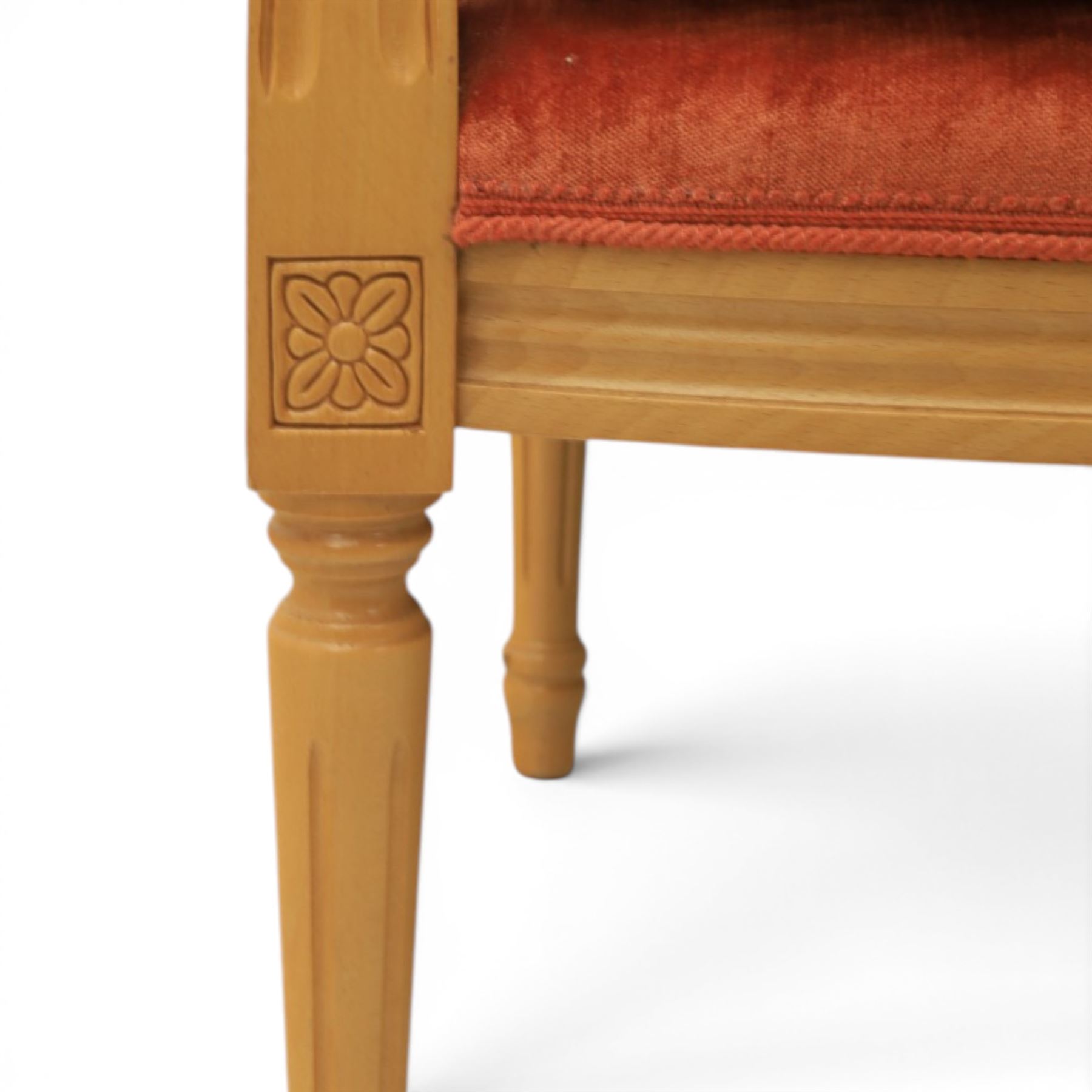 Pair of mid-20th century beechwood fauteuil armchairs, upholstered backrest and seat in terracotta velvet fabric, padded armrests with scroll detail, on tapered fluted supports with carved floral rosette blocks (very modern and not a desirable timber)