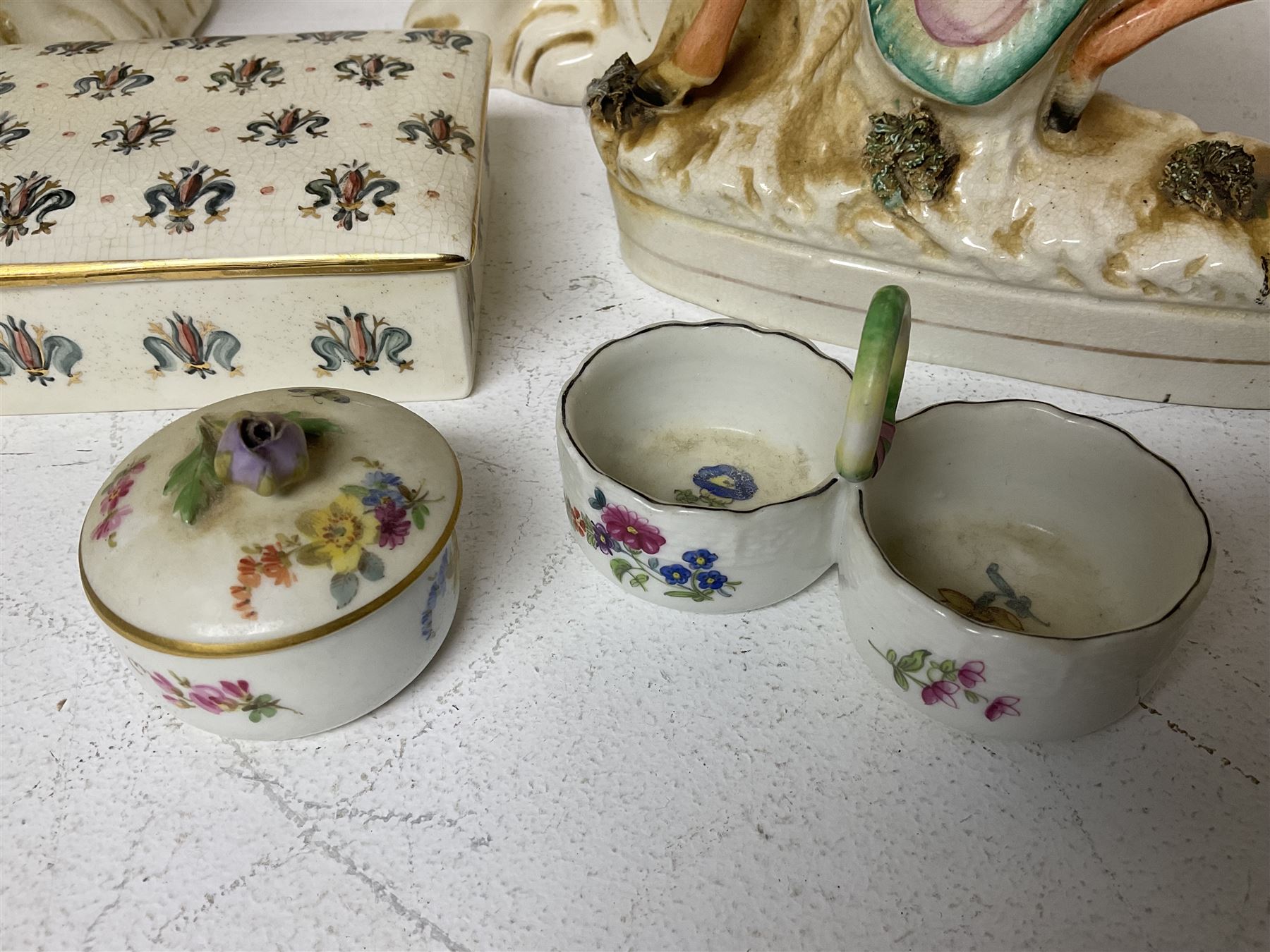 Staffordshire figure of the Duke of Wellington on a bay horse, H30cm in red uniform, together with a similar Staffordshire figure of Dick Turpin, pair of Staffordshire style dogs, H27cm, three Meissen style double salts and two trinket boxes 