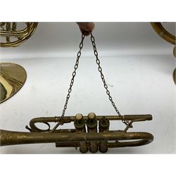 Two French horns together with a trumpet and xylophone