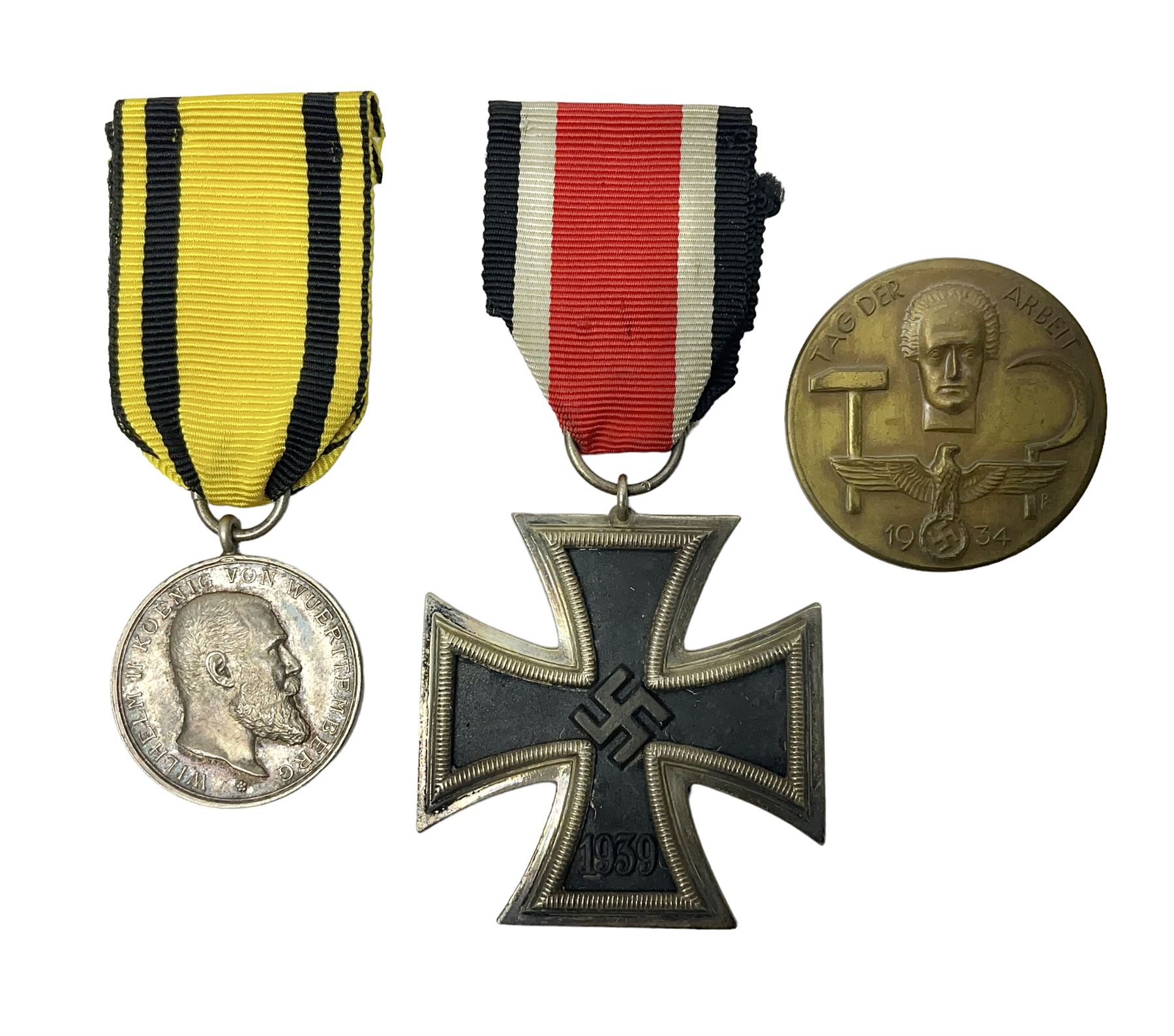 WWII German Iron Cross 2nd Class with ribbon; WWI German Wuerttemberg Medal with ribbon; and Day Badge for 1934 marked Reichsverband Pforzheim32 (3)