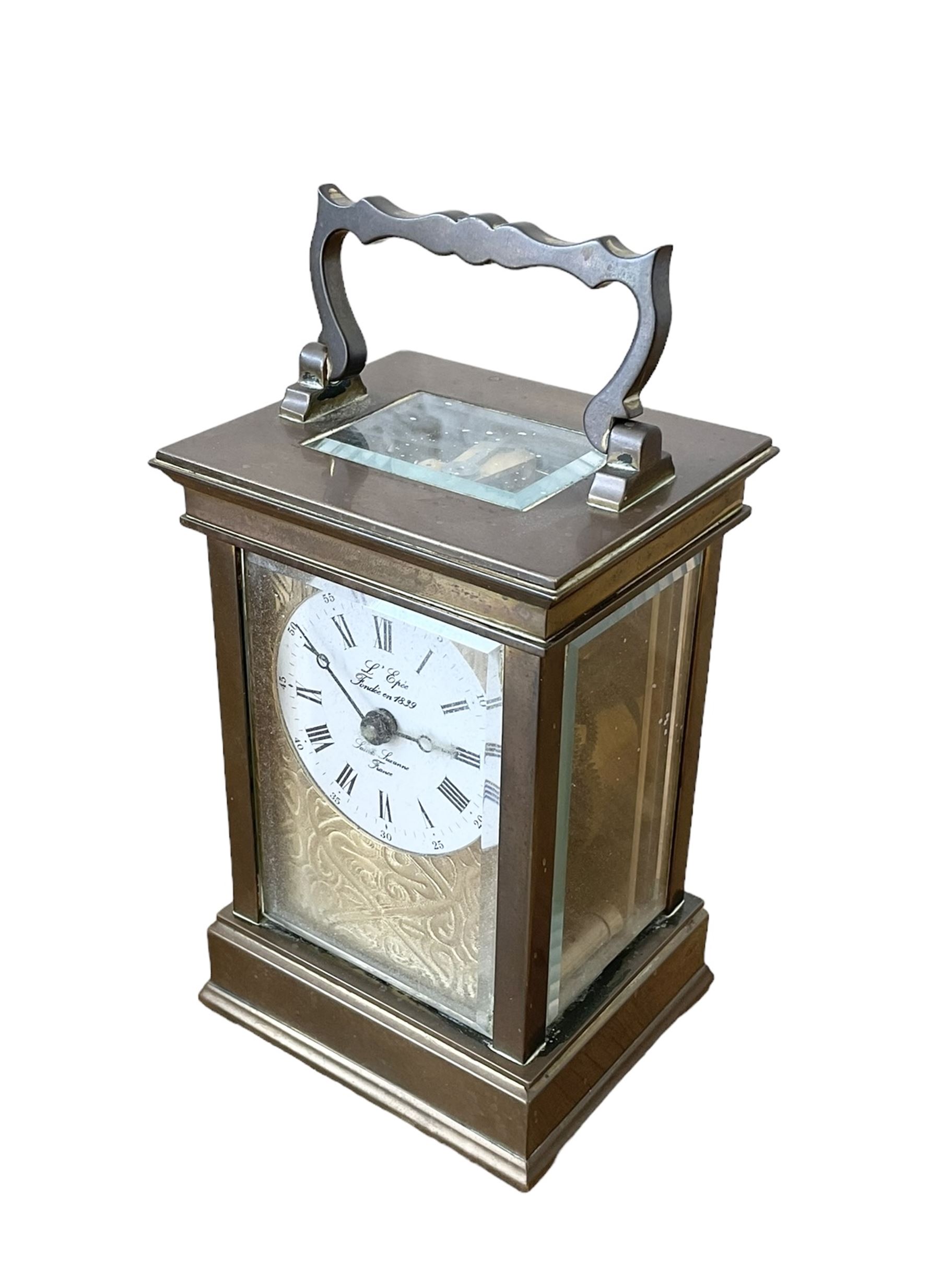 French -  brass cased 20th century  8-day timepiece carriage clock, dial inscribed L' Epee Fondee-En 1839, Sainte Suxanne, France, with a circular enamel dial and an embossed brass dial mask, Roman numerals, minute markers, five minute Arabic's and steel moon hands, with a jewelled lever platform escapement.