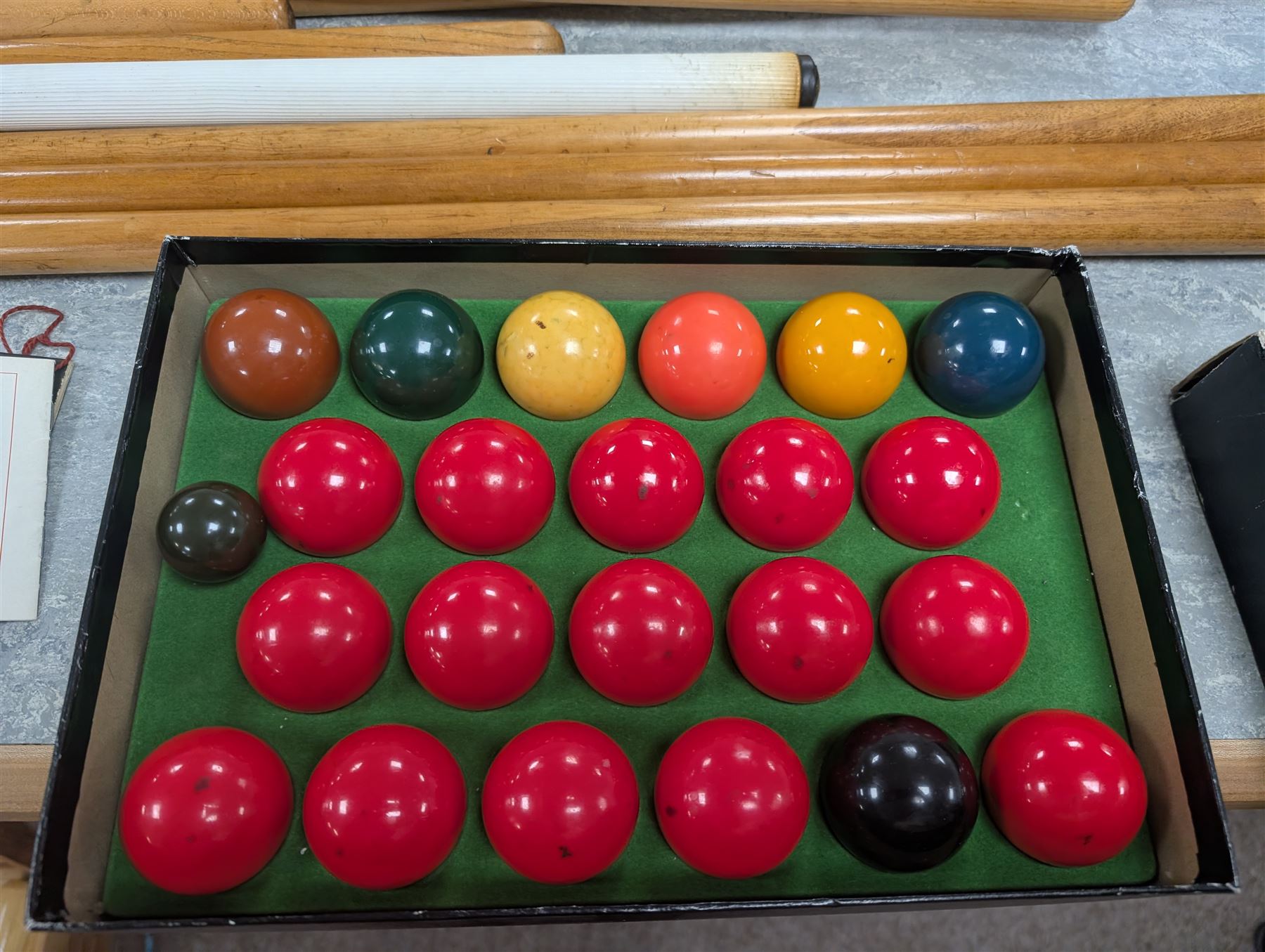 E J Riley billiard rules, together with Super Crystalate snooker balls, cue racks and a quantity of cues and extensions