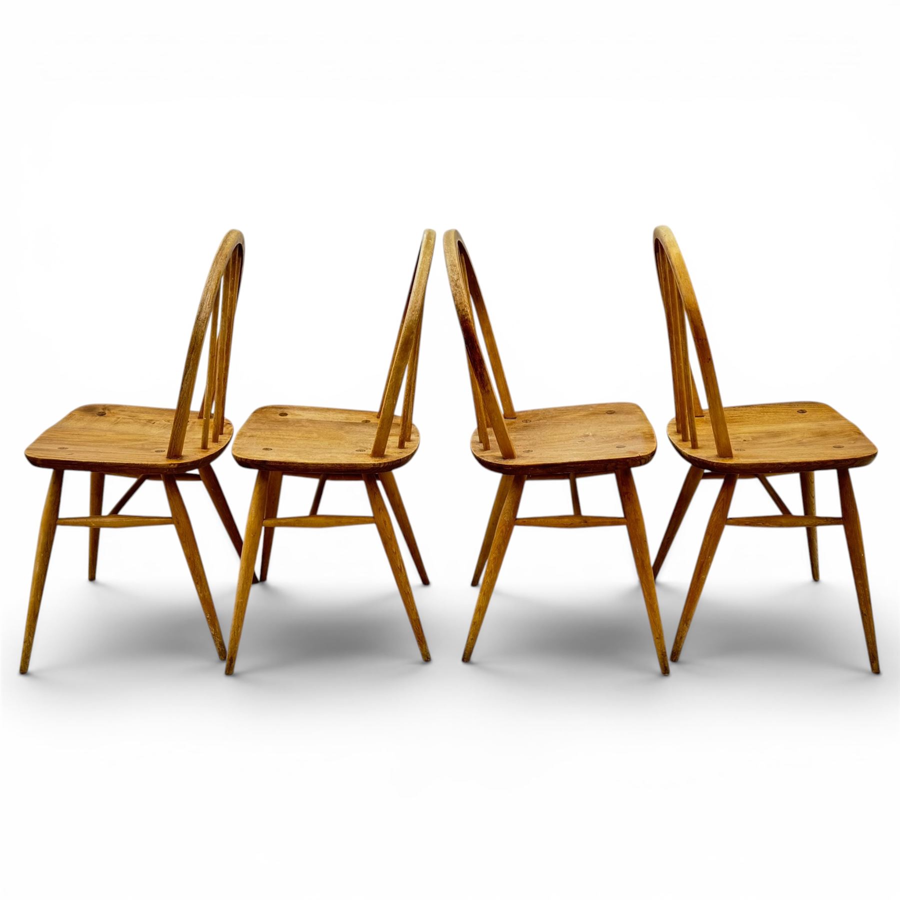 Ercol - set of four elm 'Windsor' chairs, hoop design back dish seat, tapering supports united by H-stretcher 