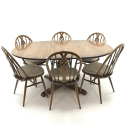 Ercol elm Old Colonial extending pedestal dining table with single leaf (W115cm and 165cm, H73cm, D115cm) and set six hoop back dining chairs (W43cm) 