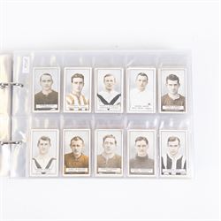 Collection of Edwardian and later Football related trading and cigarette cards, including forty-nine of fifty 1906 Ogden's Football Club Colours, 1922 PALS Footall series, ninety of one hundred 1925 Gallaher Famous Footballers, complete set of forty-four 1926 Ogden's Captains of Association Football Clubs and Colours, complete set of fifty 1927 Players Football Caricatures by MAC,  complete set of fifty 1927 Players Football Caricatures by RIP,  complete set of fifty 1930 Players Association Cup Winners, complete set of 50 1933 Ogdens AFC Nicknames etc, housed in brown cigarette card album