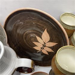 Wold studio pottery tankards, in various colours and relief decoration together with other studio items including vases, jugs and pots 