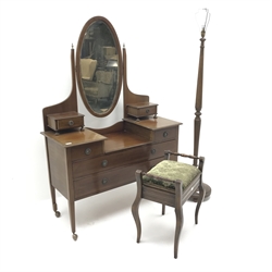  Edwardian inlaid mahogany dressing table, raised back with oval bevel edge mirror, four short and two long drawers, square tapering supports (W115cm, H170cm, D49cm) a piano stool and a standard lamp (3)  