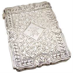 Victorian silver card case, of shaped rectangular form, the front engraved with monogram to central lozenge, and lion crest to lozenge verso, with engraved stylised foliate surround, hallmarked Frederick Marson, Birmingham 1891, H9.5cm, approximate weight 1.81 ozt (56.5 grams)