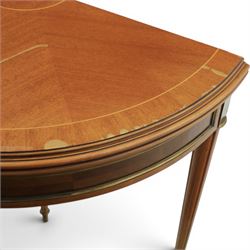Regency revival mid 20th century walnut card table, demi lune form inlaid with boxwood, kingwood frieze with brass detail fold-over top with retractable back leg, revealing circular leather playing surface, circular tapering legs