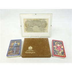  Bank of England Peppiatt ten shilling note C78D 664684, in clip frame, and unused boxed set of Waddingtons playing cards (2)  