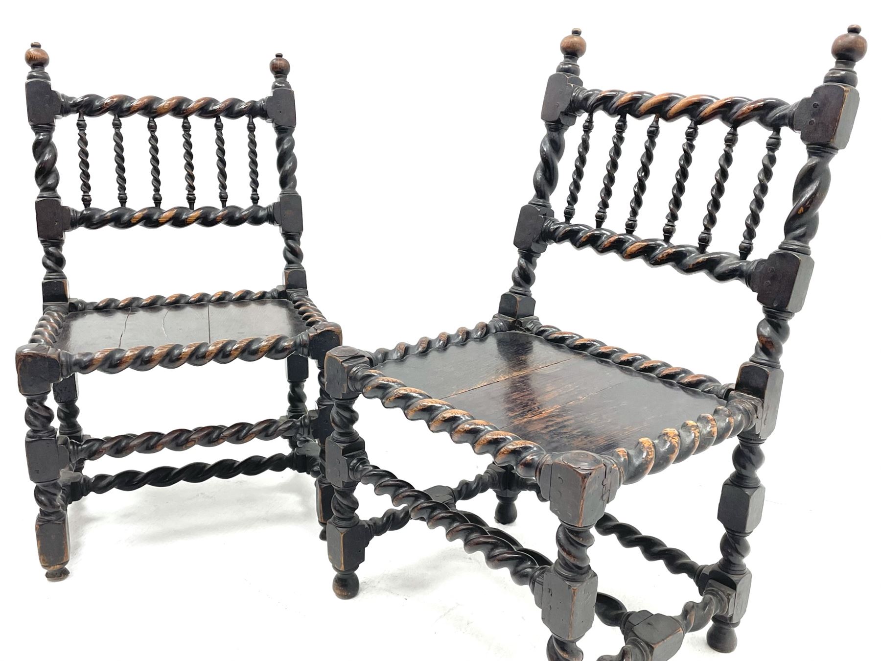 Unusual pair late 17th century oak spindle-back chairs, barley twist or spiral turned throughout, the back with a row of six vertical turned spindles, the supports joined by two lower rails and front central rail, plank seats

Provenance - The chairs illustrated in 'Early British Chairs and Seats 1500-1700' by Tobias Jellinek (Pub: Antique Collectors Club. 2009. p 313). Previous part of a private collection. Vendor purchased from auction 2014.

Measurements - seat width - 48cm, seat height - 38cm/36cm, depth - 50cm, total height - 85cm/82cm