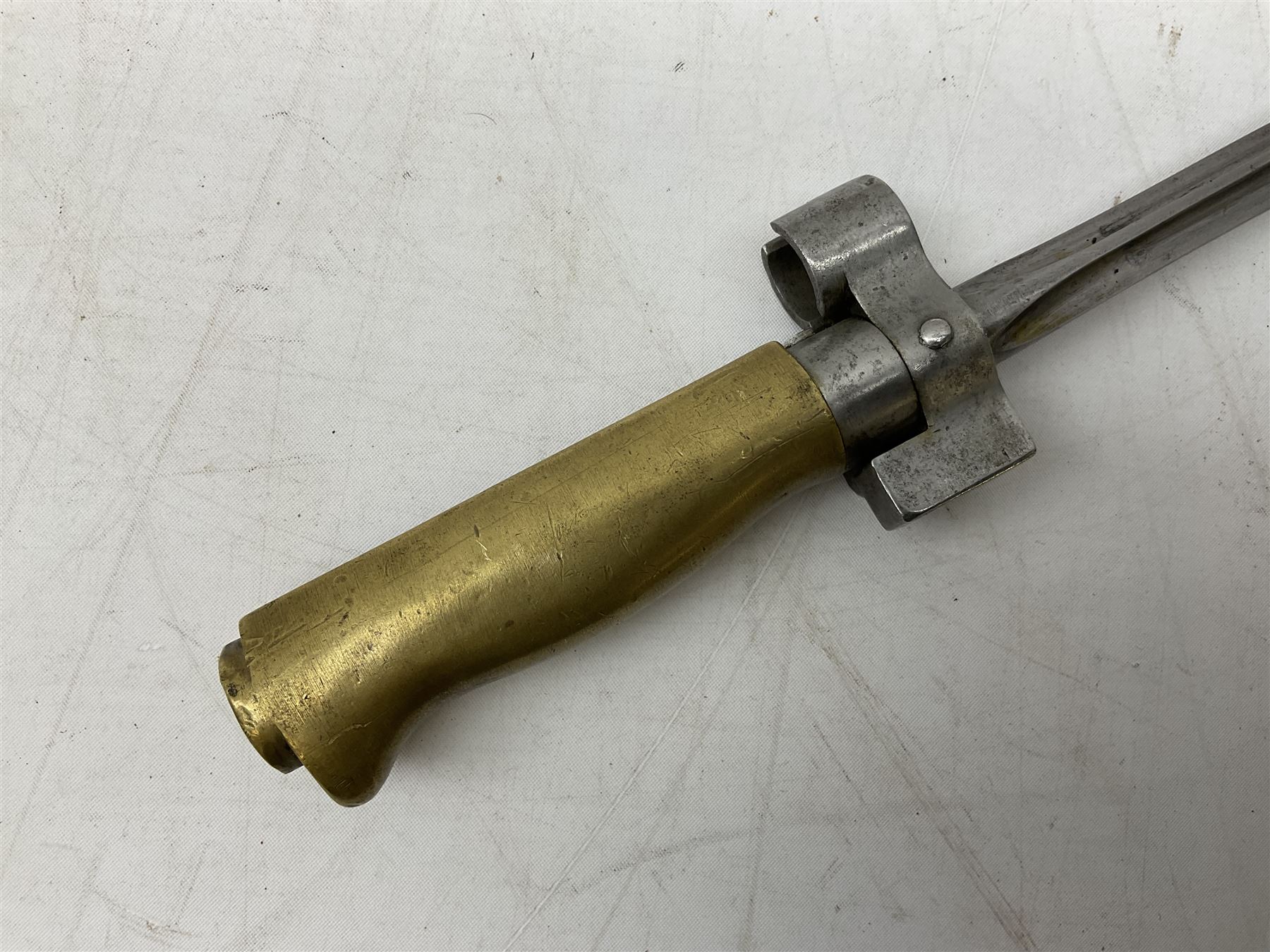 French Lebel Model 1886/93/16 bayonet with 52cm steel cruciform blade and brass hilt No.R22136; in steel tapering round scabbard numbered A62918 L65.5cm overall