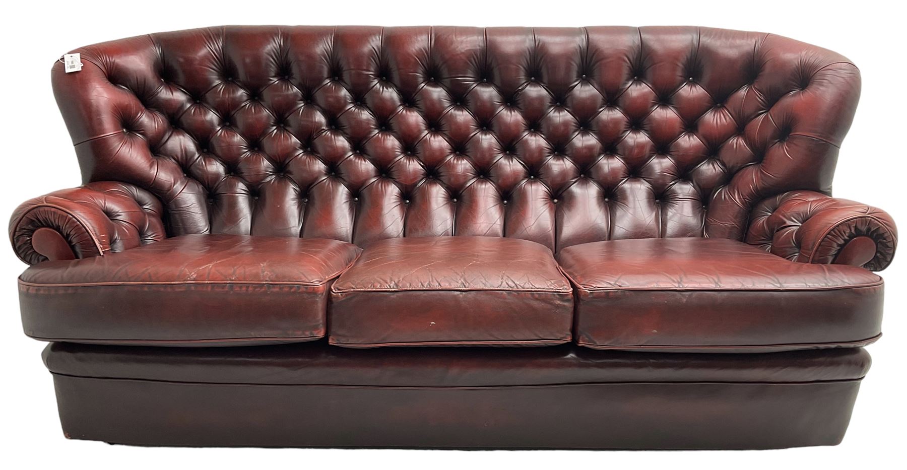 Wade - Georgian design three-seat sofa, high curved back over scrolled arms, upholstered in deep buttoned oxblood 'Pegasus' leather, on castors
