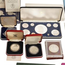 Three international proof coin sets produced by The Franklin Mint and containing high denomination silver coins, comprising Republic of Seychelles 1976 eight coin set, Republic of Panama 1976 nine coin set, Papua New Guinea 1976 eight coin set; four silver proof one ounce coins; eight Royal Mint international year sets, etc