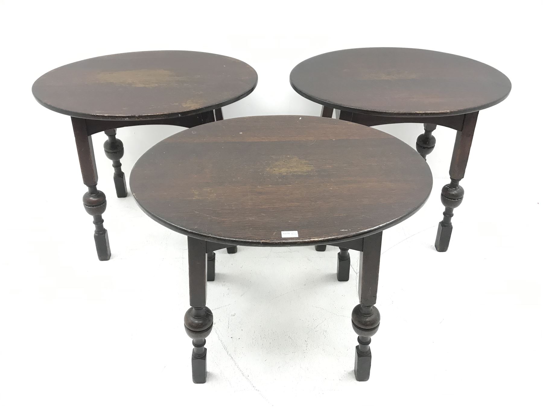 Three oval bog oak bar tables, square supports with cup and cover detailing
