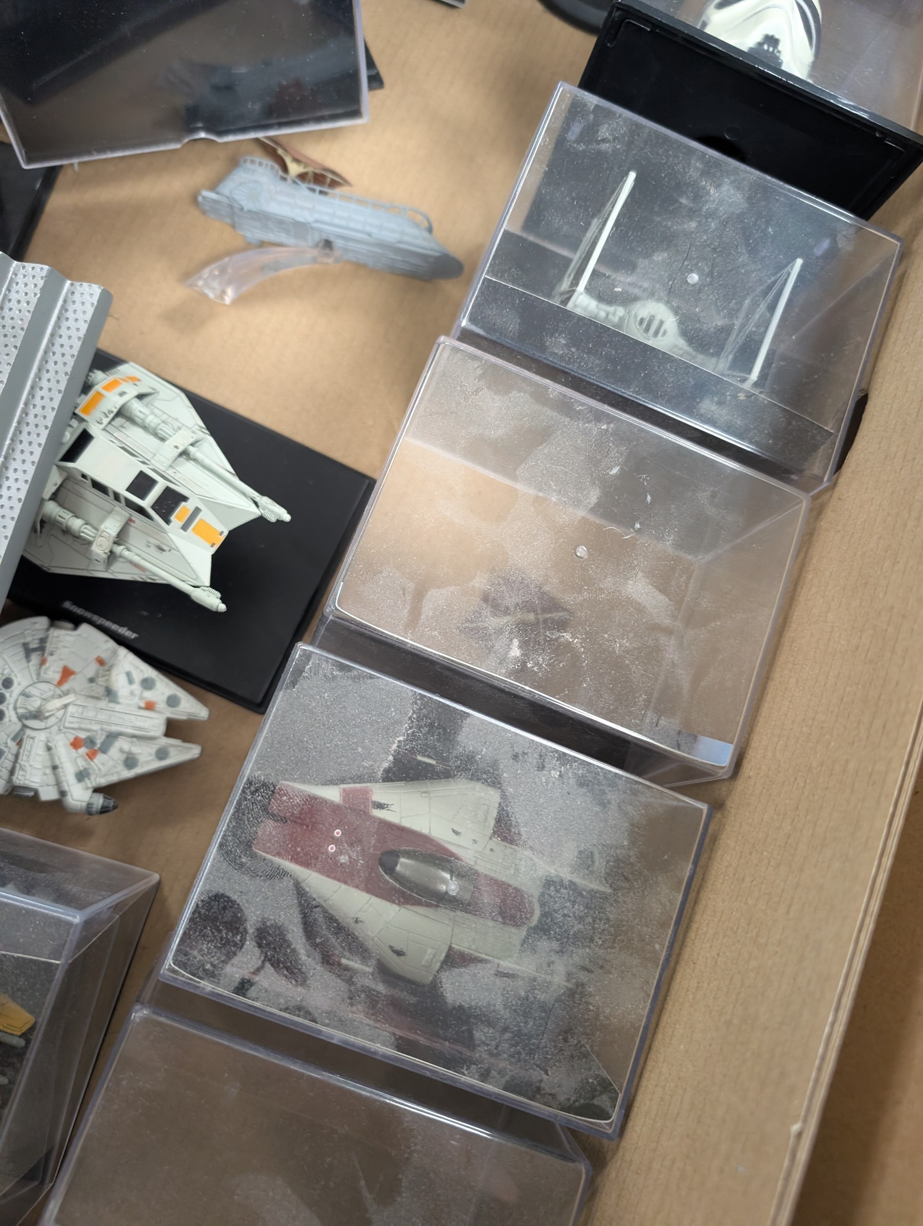 Collection of DeAgostini Star Wars figures, including two limited edition Darth Vader figures, diecast vehicles and figures and miniature helmets