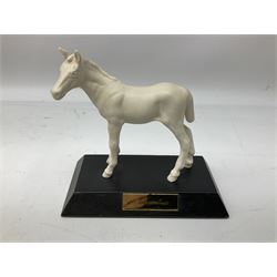 Collection of Beswick figures comprising horses head and horseshoe wall plaques, no.806 and 807 and three Beswick white matte glazed horses by Graham Tongue, comprising ‘Spirit of Fire’, ‘Adventure’ and ‘Spirit of the Wind’ (a/f), all marked beneath (5)