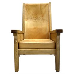 'Mouseman' oak smokers armchair, panelled sides, slung tan leather back and upholstered seat cushion, by Robert Thompson of Kilburn